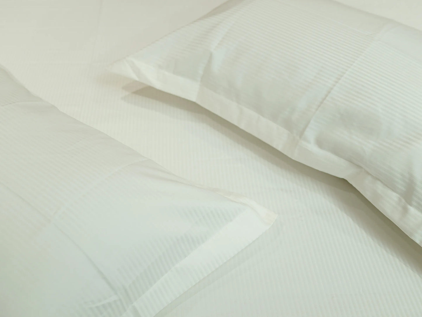 Apex minimalist luxury bedding in snow white with a 500 TC self stripe design