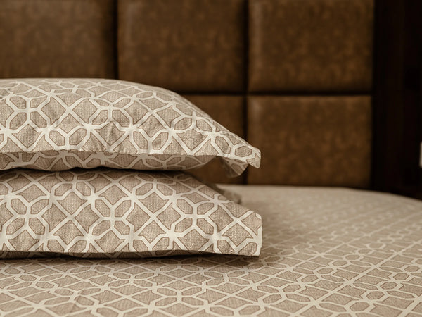 Stacked Prism almond pillow covers showcasing premium cotton fabric, refined stitching, and soft geometric abstract pattern