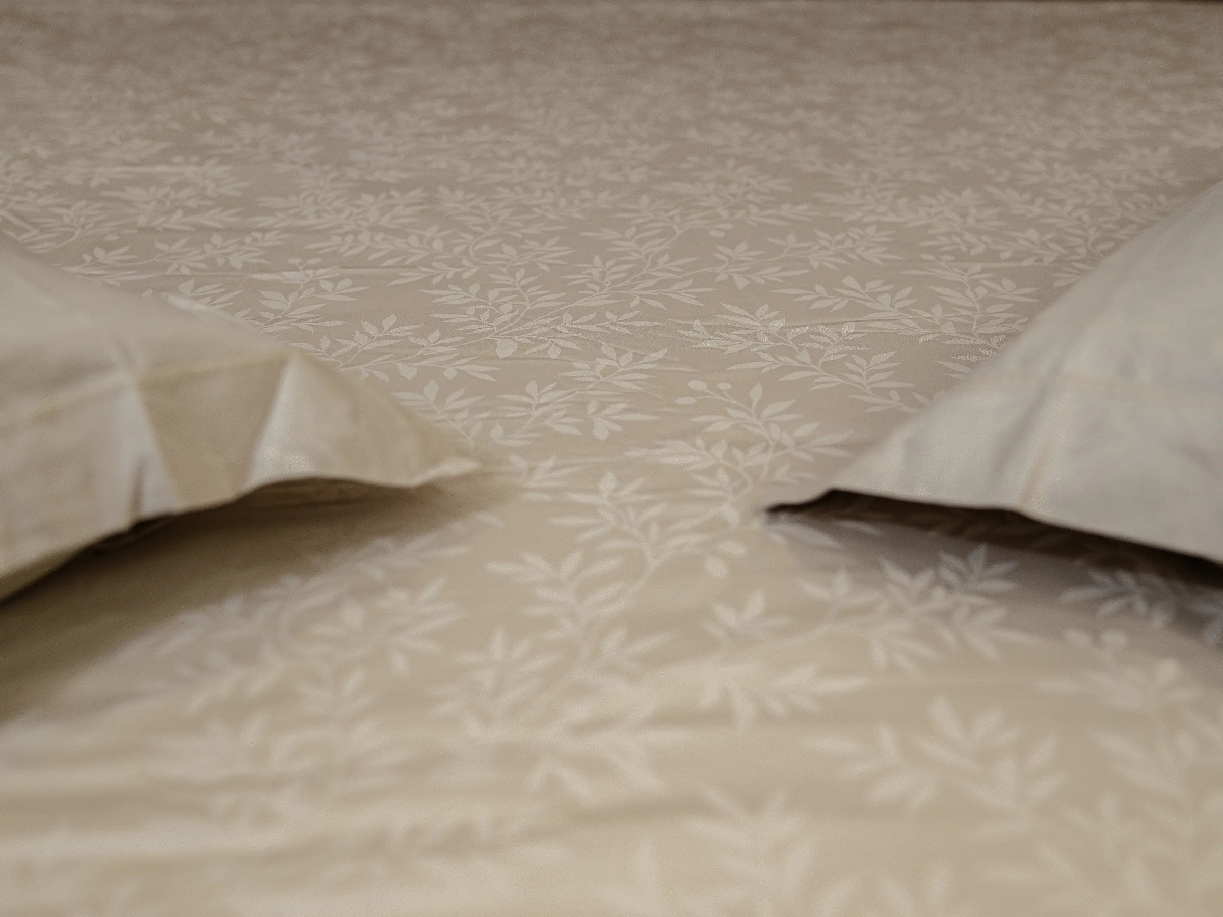 Svelte premium grey linen bedsheet with soft pillows, refined jacquard detailing, and silky-smooth luxury bedroom appeal