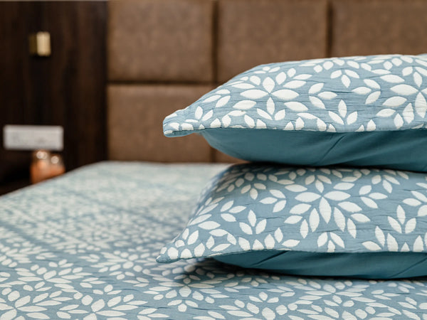Luxury powder blue jacquard cotton bedsheet styled on a bed with elegant pattern and premium comfort 