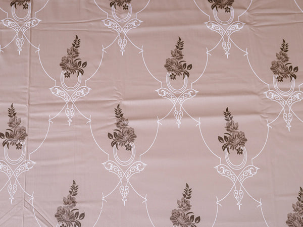 Close-up of beige and brown Egyptian cotton bedsheets showcasing intricate floral Egyptian pattern and premium woven texture