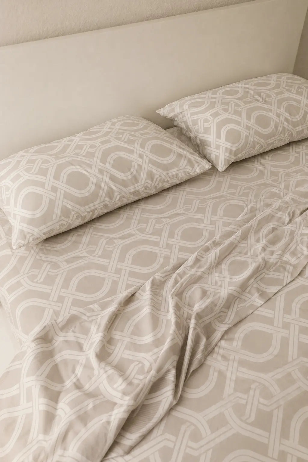 Close-up of Chaste luxury beige cotton bedsheet with matching pillow cover, highlighting soft 500 thread count fabric and hotel-quality comfort