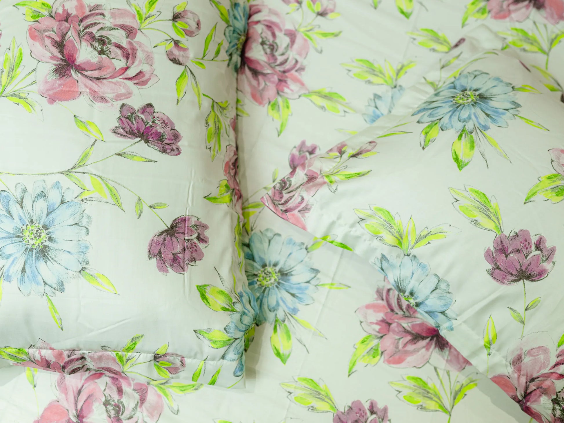 Detailed view of Mosaic luxury cotton bedsheet showing smooth fabric folds and fresh floral artwork in pastel tones