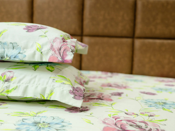 Stacked Mosaic pillow covers in creamy white floral cotton fabric showcasing soft texture and elegant luxury finishing