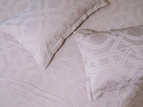 Close-up of Pristine grey luxury cotton bedsheet with matching pillow cover showcasing soft 500 thread count fabric and interlocking pattern
