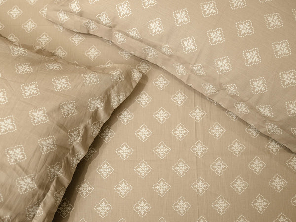 Close-up of Flux hazelnut luxury cotton bedsheet showcasing the elegant abstract woven pattern and smooth 500 thread count fabric