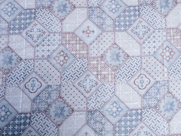 Close-up of Echelon luxury cotton bedsheet showcasing indigo blue mosaic tile pattern with delicate artistic detailing