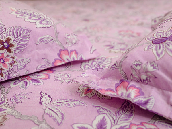 Close-up of Rhythm mauve pink floral bedsheet highlighting smooth organic cotton texture and refined luxury bedsheet design.