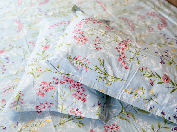 Fabric close-up of detailed view of Heirloom mint blue floral print on 500 thread count organic luxury bedsheet