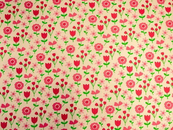 Close-up of Verve off white and pink luxury bedsheet showcasing delicate red and pink vintage floral design on smooth cotton fabric