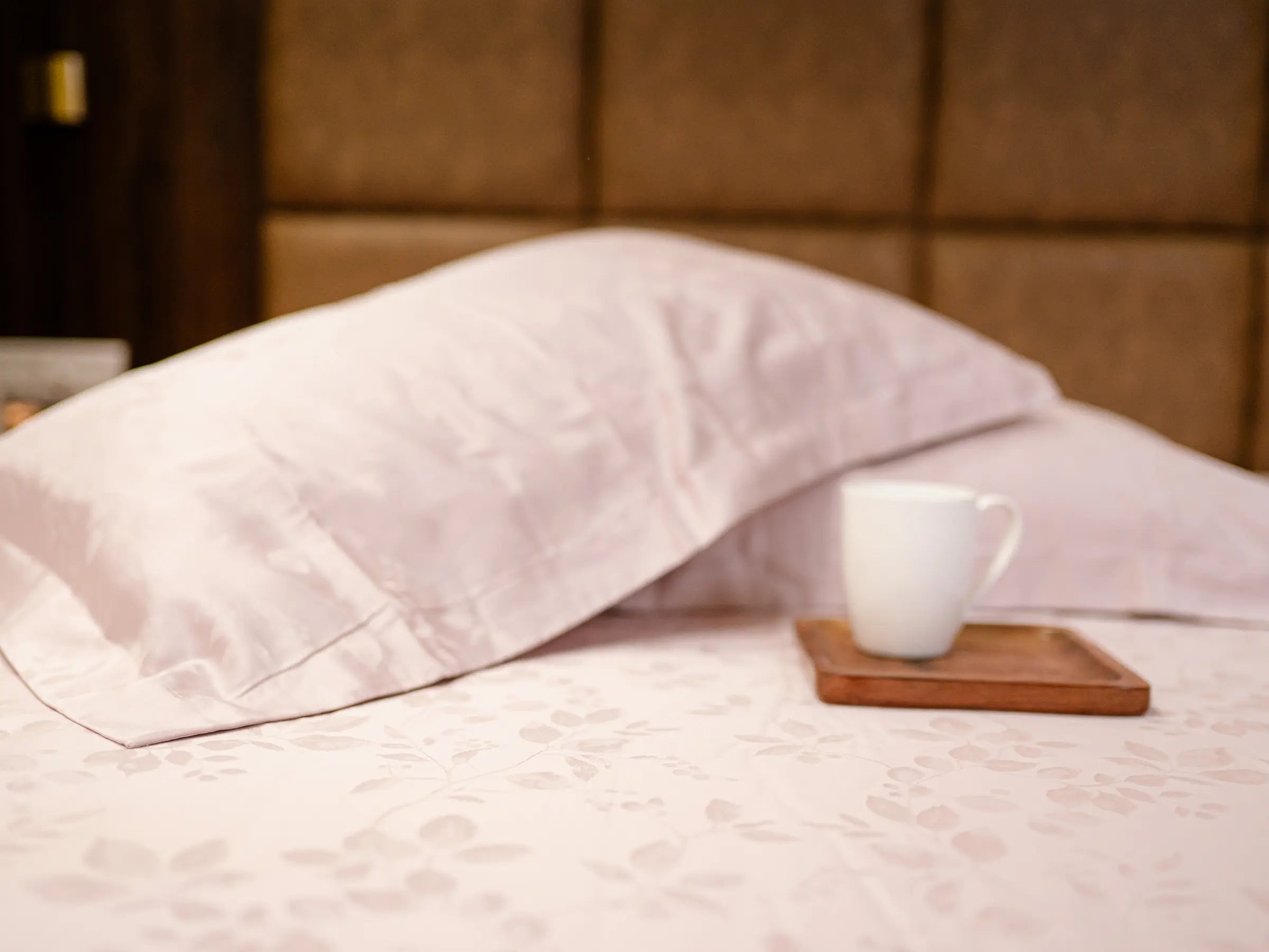 Luxury pink champagne organic cotton jacquard bedsheet with matching pillow cover displaying premium hotel-quality craftsmanship