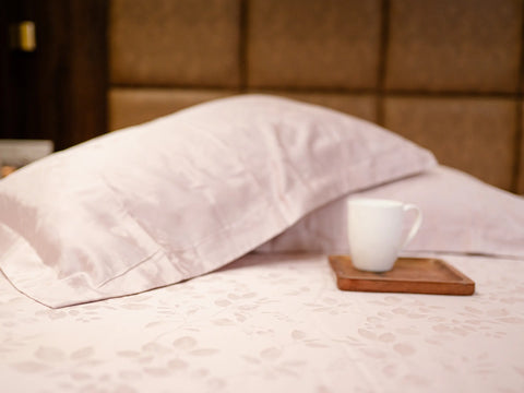Luxury pink champagne organic cotton jacquard bedsheet with matching pillow cover displaying premium hotel-quality craftsmanship