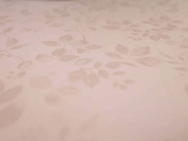 Close-up of pink champagne organic cotton jacquard bedsheet showcasing premium woven texture and elegant 1000 thread count fabric