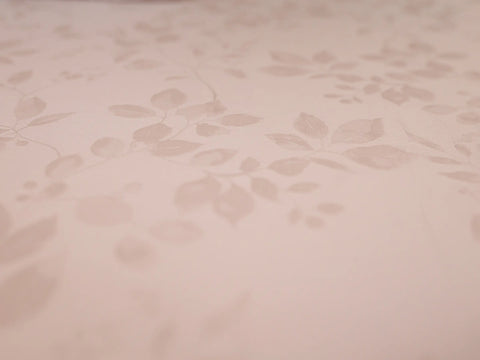 Close-up of pink champagne organic cotton jacquard bedsheet showcasing premium woven texture and elegant 1000 thread count fabric