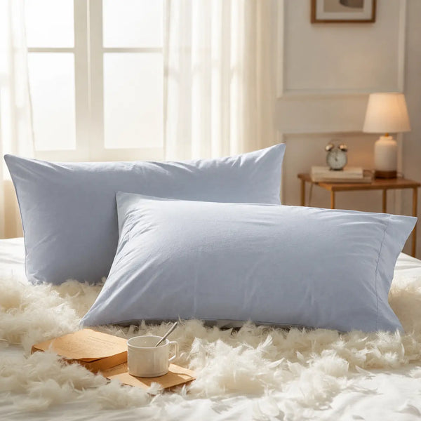 Powder blue Tapestry pillow covers in premium cotton styled on a cozy bedroom setting for a soft luxury bedding look