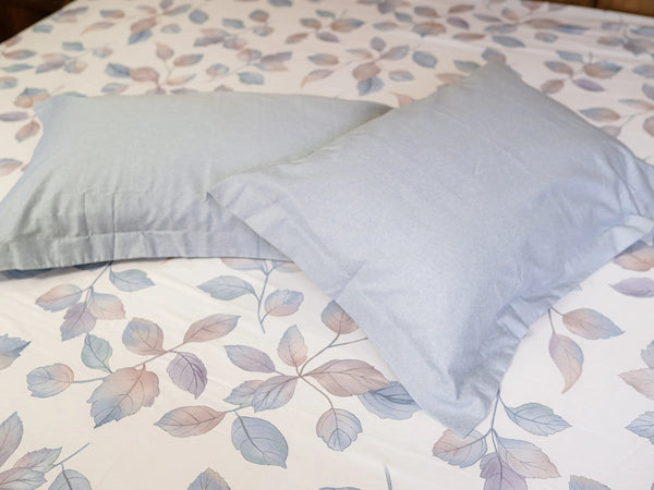 Tapestry luxury cotton bedsheet with powder blue pillow cover showcasing delicate nature-inspired botanical print and smooth fabric