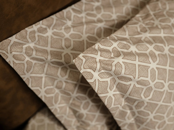 Close-up of Prism luxury bedsheet with matching pillow cover highlighting smooth 500 thread count cotton and neutral beige lattice design