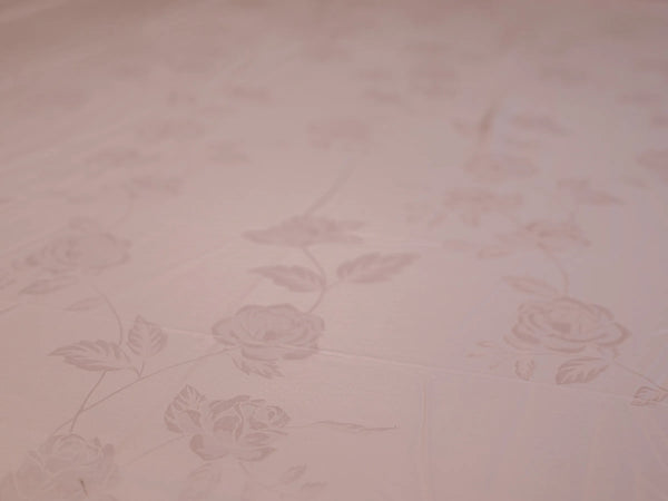 Close_up of rose gold organic cotton jacquard bedsheet showcasing premium woven texture and silky smooth 1000 thread count fabric