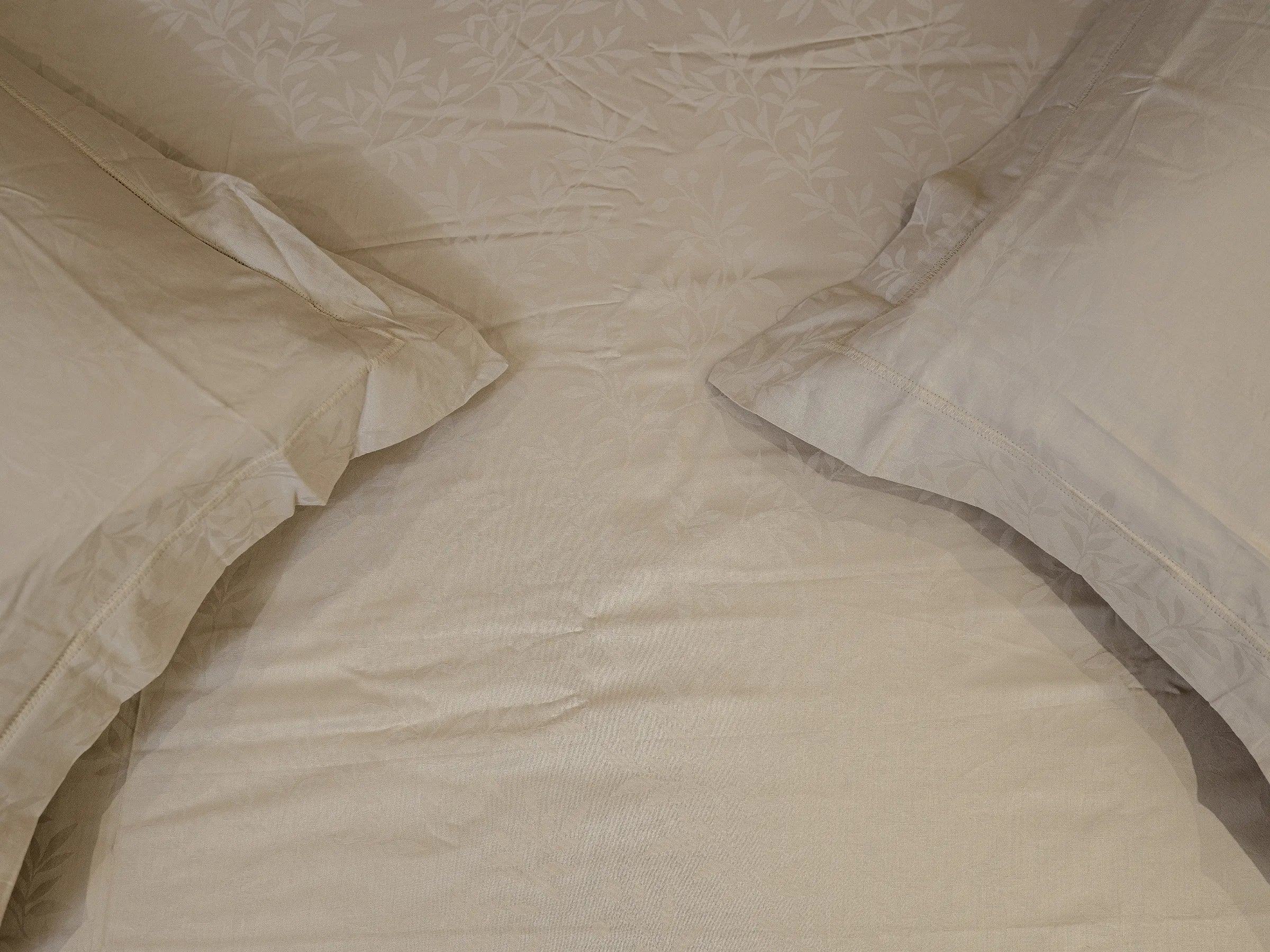 Svelte grey linen luxury bedsheet with matching pillow covers showcasing smooth 700 thread count texture and breathable premium finish