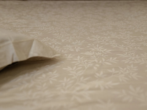 Close-up of Svelte luxury linen bedsheet highlighting subtle botanical vine self-jacquard pattern and soft hypoallergenic fabric